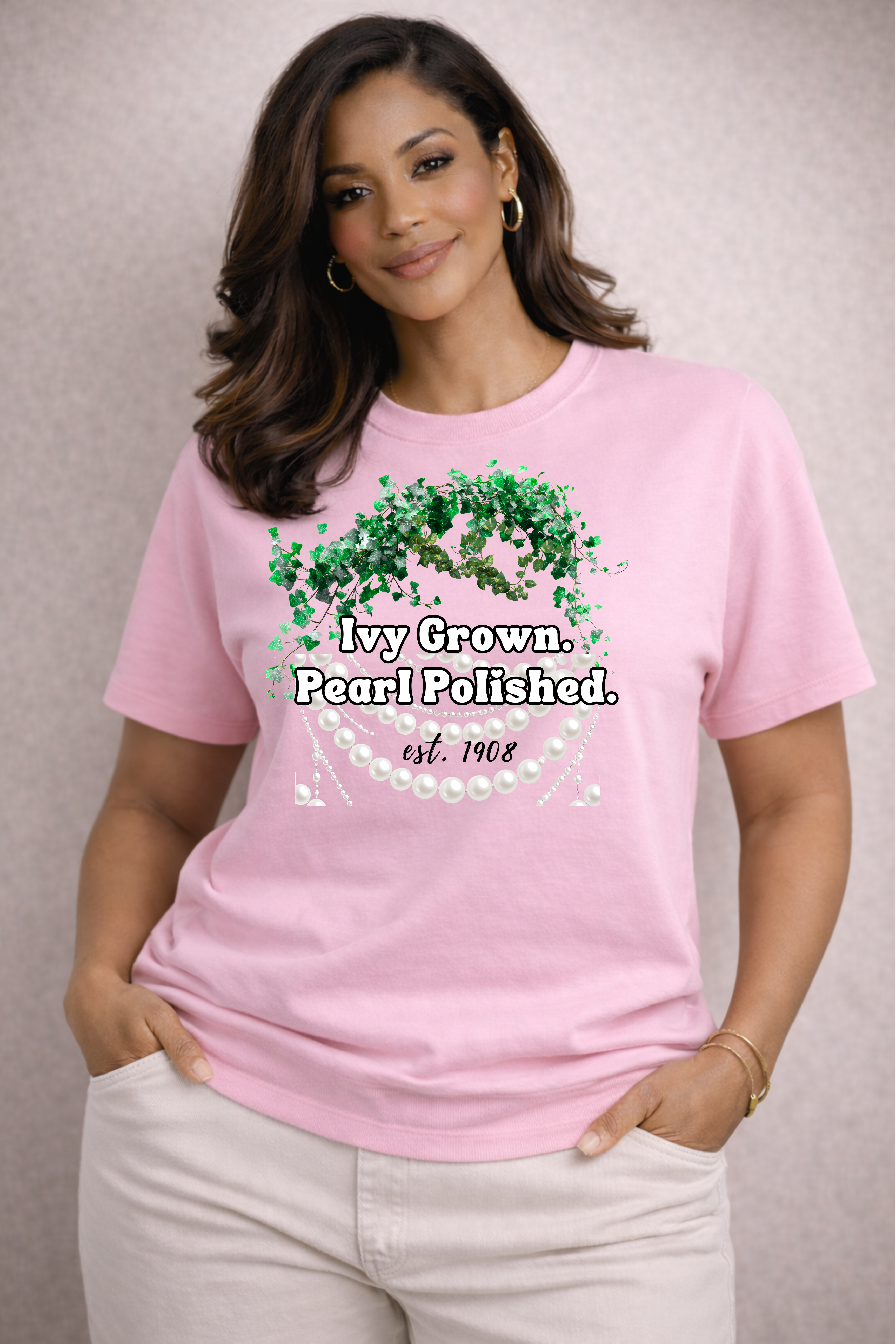 Woman wearing a pink t-shirt with text and graphics on a plain background
