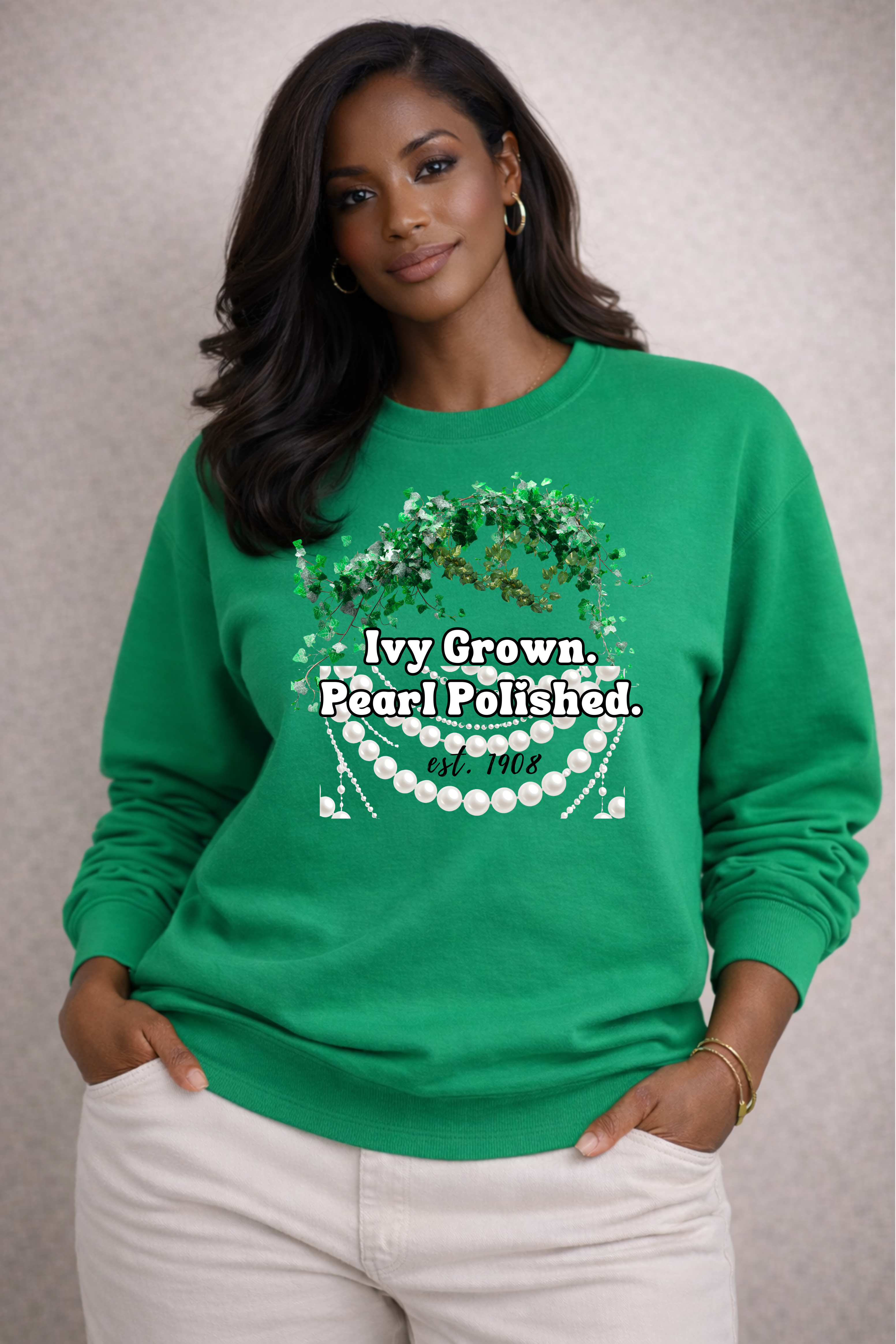 Woman wearing a green sweatshirt with text and graphics on a neutral background